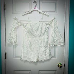 Shoulderless Charlotte Russe white lace romper
